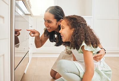 Buy stock photo Baking, oven and mom with girl in kitchen to check for cake, cupcakes and dessert for bonding relationship. Family, home and mother with child waiting for cooking, recipe and learn for fun together