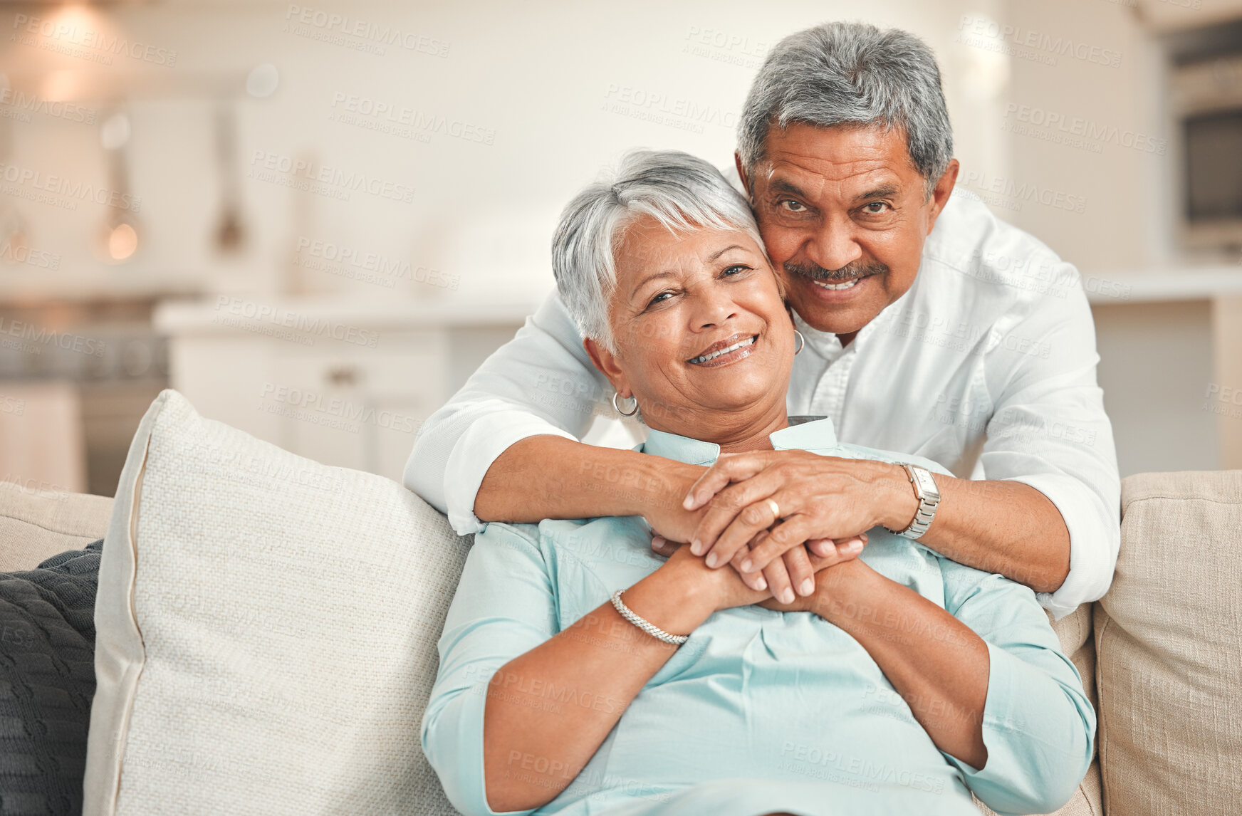 Buy stock photo Portrait, love and senior couple in living room, smile and bonding of old man and woman with hug. Lounge, sofa and embrace of elderly people with commitment to marriage, care and support in house