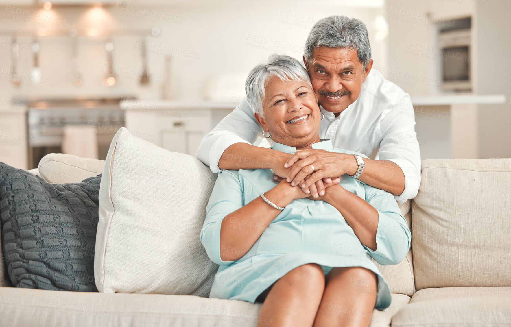 Buy stock photo Portrait, hug and senior couple in living room, smile and bonding of old man and woman with love. Lounge, sofa and embrace of elderly people with commitment to marriage, care and support in house