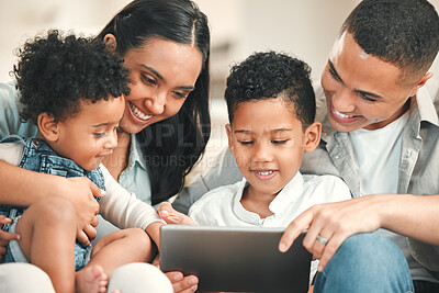 Buy stock photo Young happy family, kids and tablet on couch for game, movie or learning together in home, love and bonding. Parents, education and children on living room sofa with smile, care or app on touchscreen