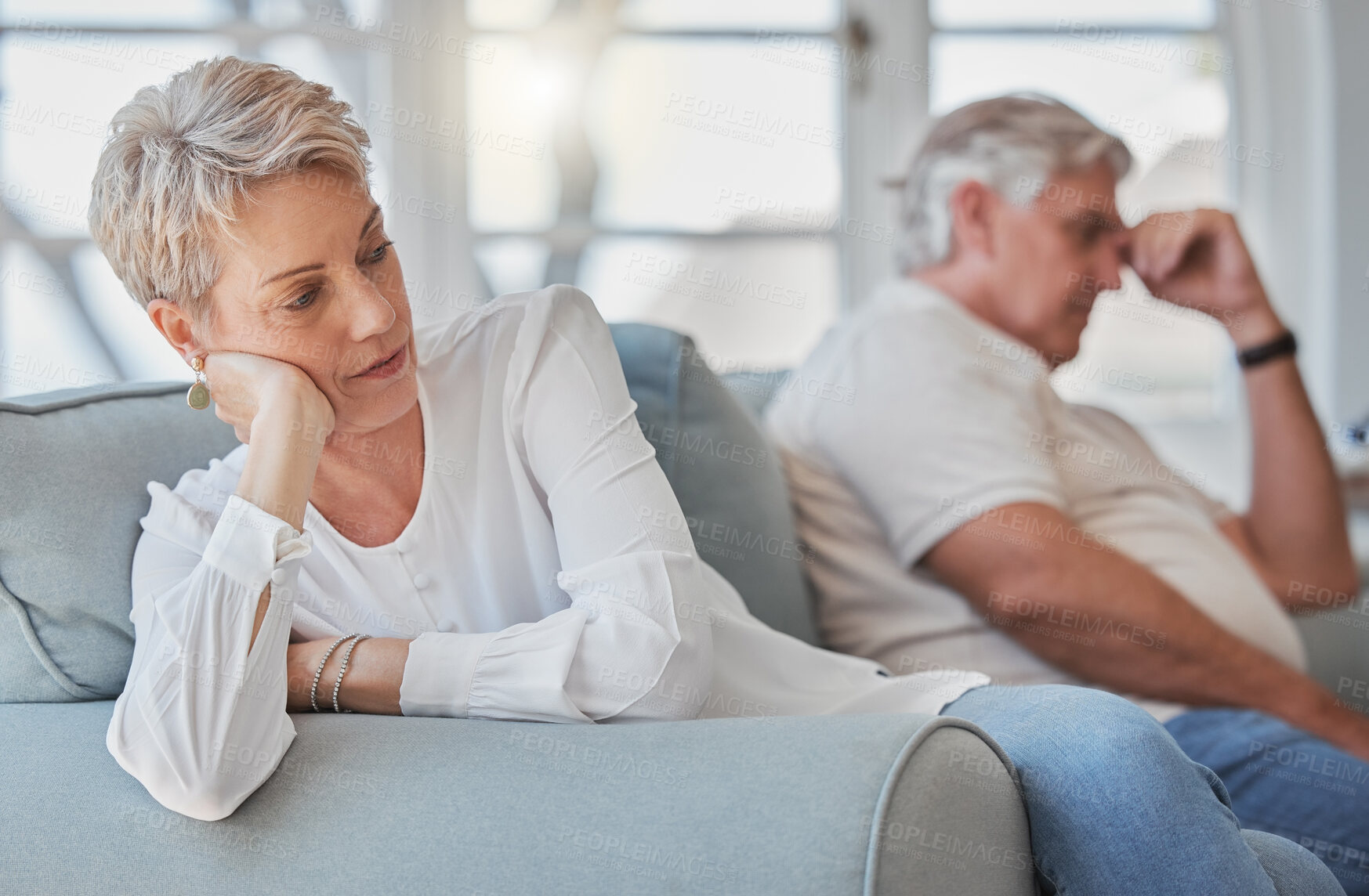 Buy stock photo Divorce, conflict and mature couple on sofa with crisis for marriage, relationship and partnership fail. Home, living room and man and woman upset, mad and frustrated for fighting, argument or stress