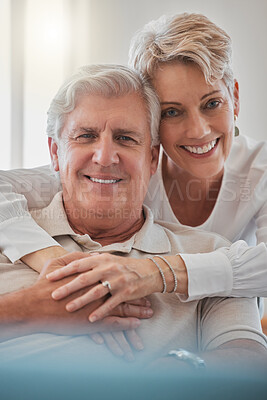 Buy stock photo Cropped portrait of an affectionate senior couple relaxing in their living room at home