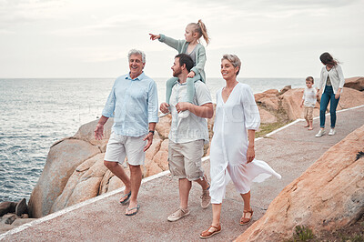 Buy stock photo Shot of a happy family enjoying a day along the coast
