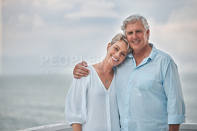 Buy stock photo Shot of a mature couple enjoying a romantic day along the coast
