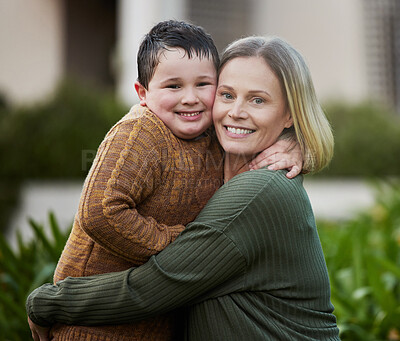 Buy stock photo Shot of a mother hugging her son