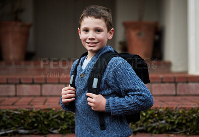 Buy stock photo Shot of a little boy getting ready to go to school