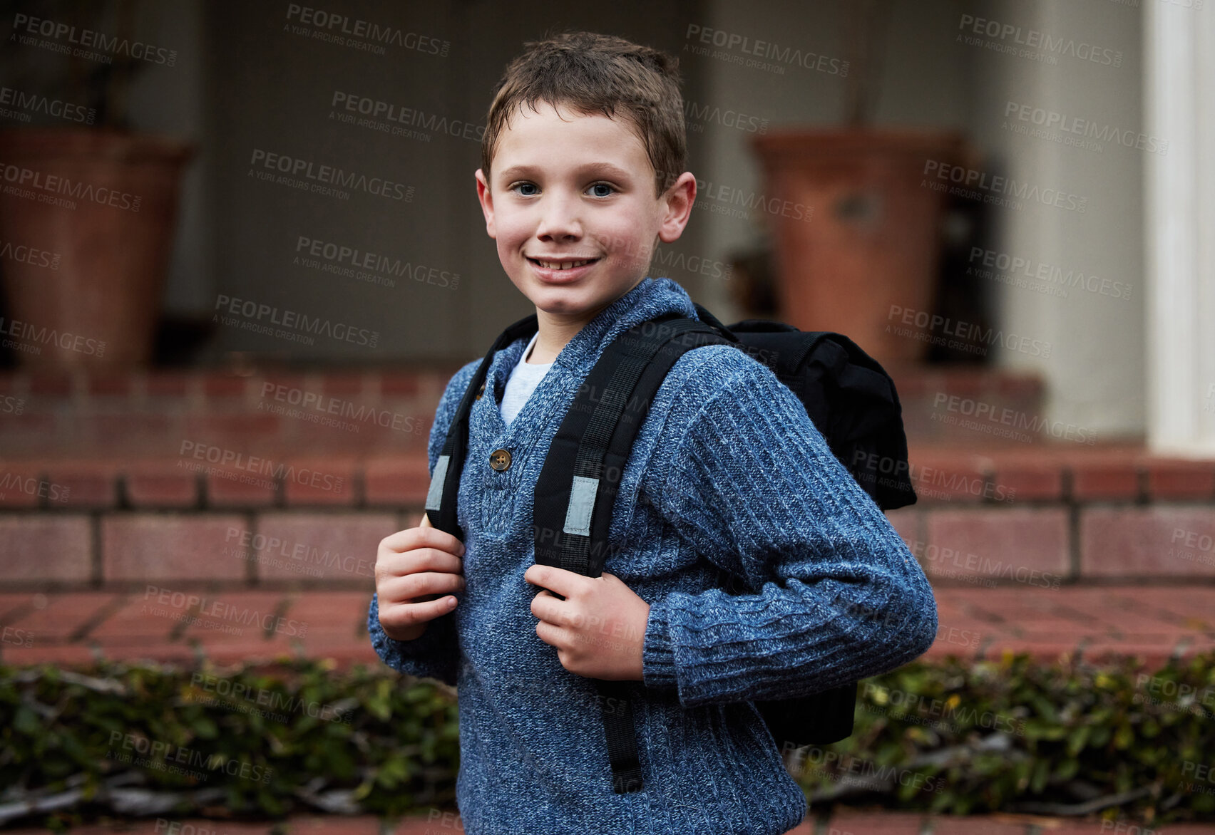 Buy stock photo Shot of a little boy getting ready to go to school