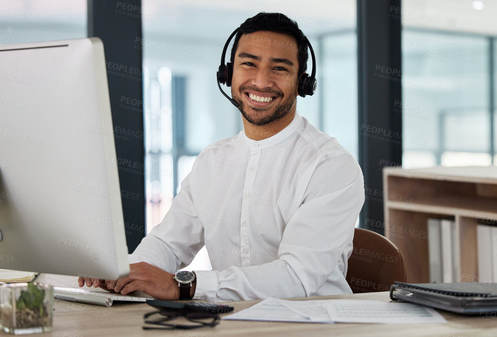 Buy stock photo Shot of a young man working in a call center