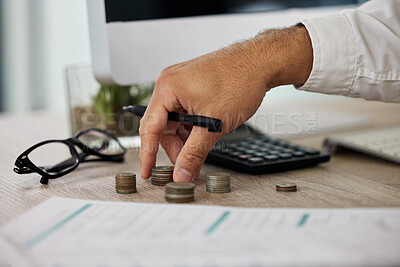 Buy stock photo Shot of a businessman calculating his finances