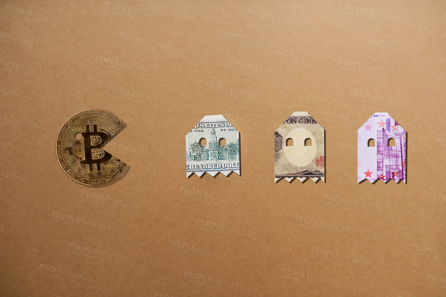 Buy stock photo Studio shot of bitcoin pacman chasing the money alines against a brown background