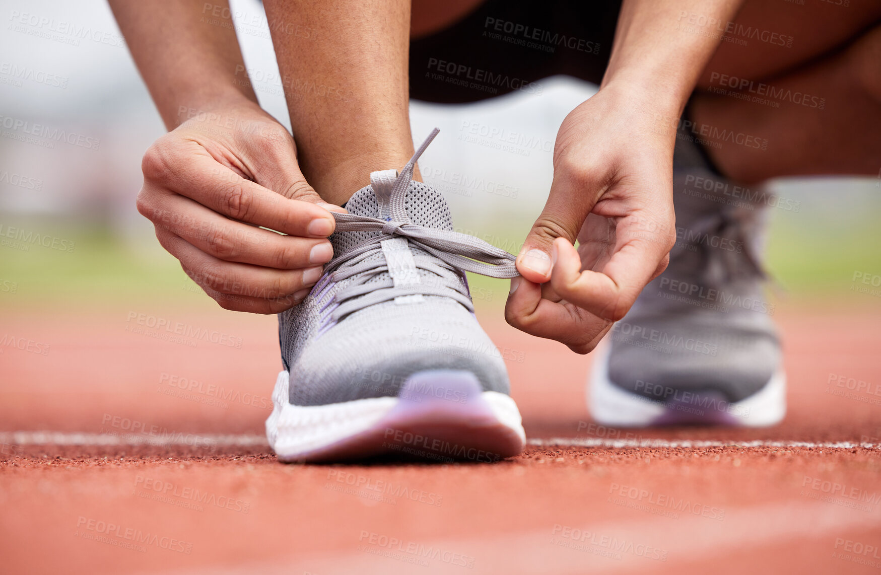 Buy stock photo Person, shoe tie and start in sport stadium for running, challenge and training at health and fitness venue. Feet, hands and workout of athlete ready for cardio in arena with exercise and sneakers