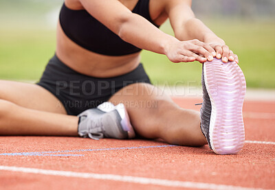 Buy stock photo Cropped shot of an unrecognizable female athlete going through her warmups out on the track