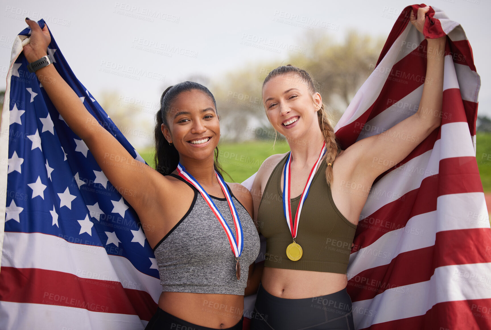 Buy stock photo Women, portrait and gold medal with USA flag, achievement and running award outdoor. Marathon, trophy and stadium win with runner group and smile from competition success with team celebration