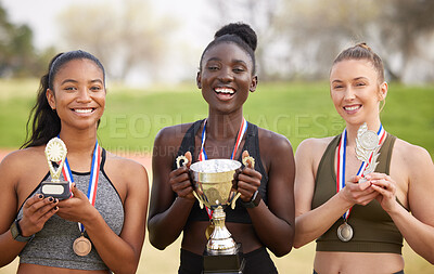 Buy stock photo Women, gold and celebration with trophy as athlete for win, competition and sports achievement outdoor. Team, portrait and success with professional running, award and podium performance as champion