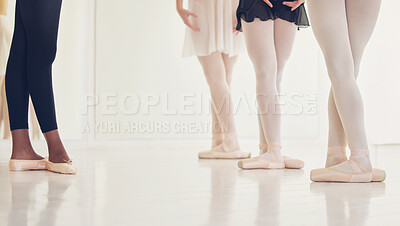 Buy stock photo Shot of a group of unrecognizable ballet dancers during their rehearsal in a studio
