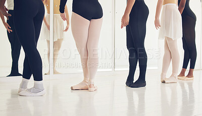 Buy stock photo Shot of a group of unrecognizable ballet dancers during their rehearsal in a studio