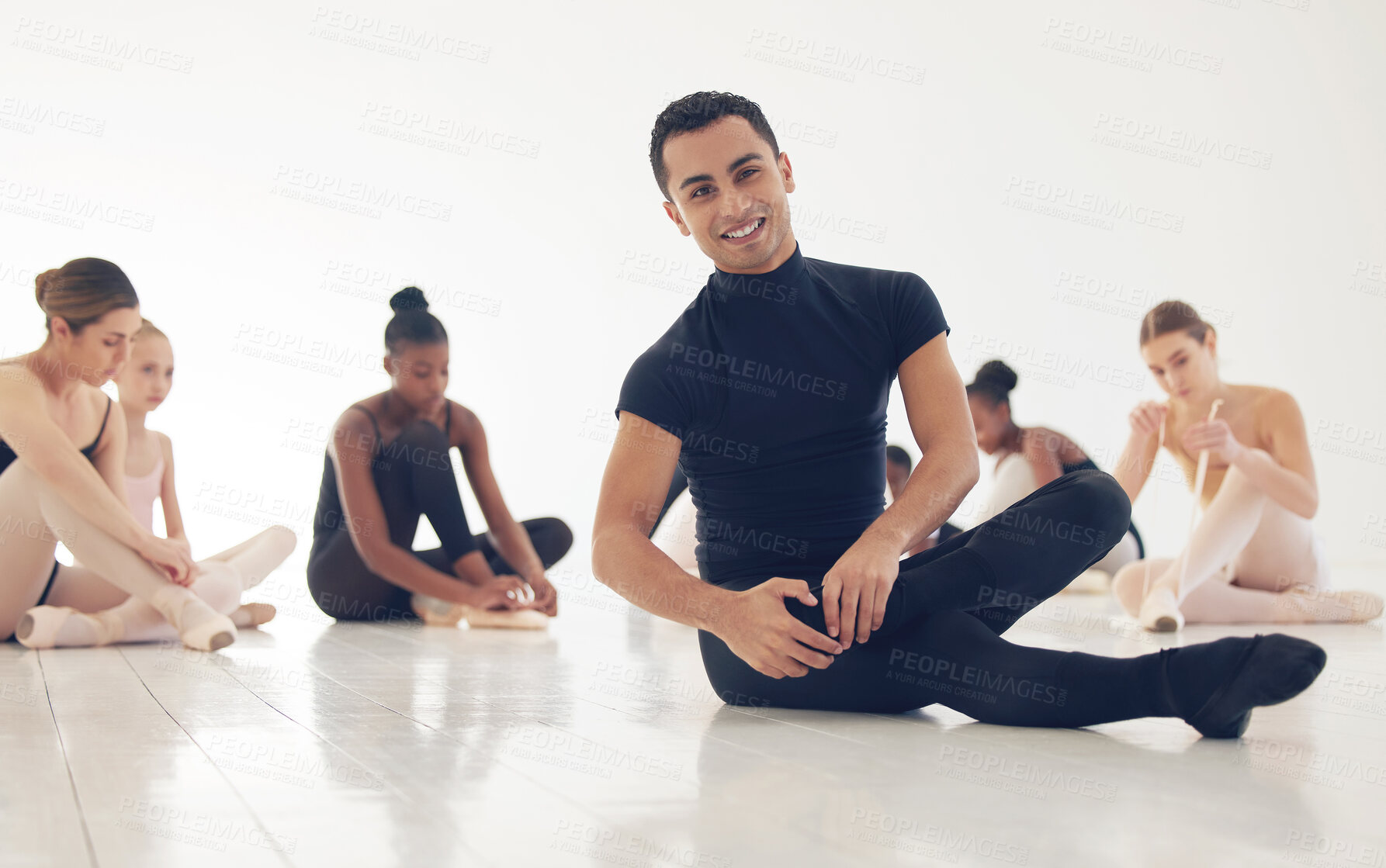 Buy stock photo Ballet, students and portrait of man stretching on floor together for practice, exercise or flexibility. Art, dance studio and wellness, people warm up for fitness or creative performance in class