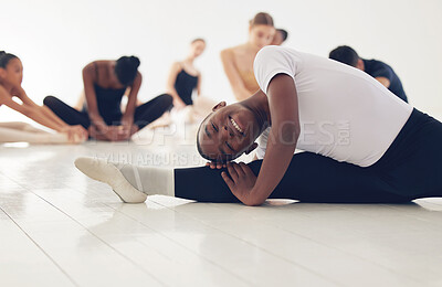 Buy stock photo Shot of a group of ballerinas warming up before practicing their routine