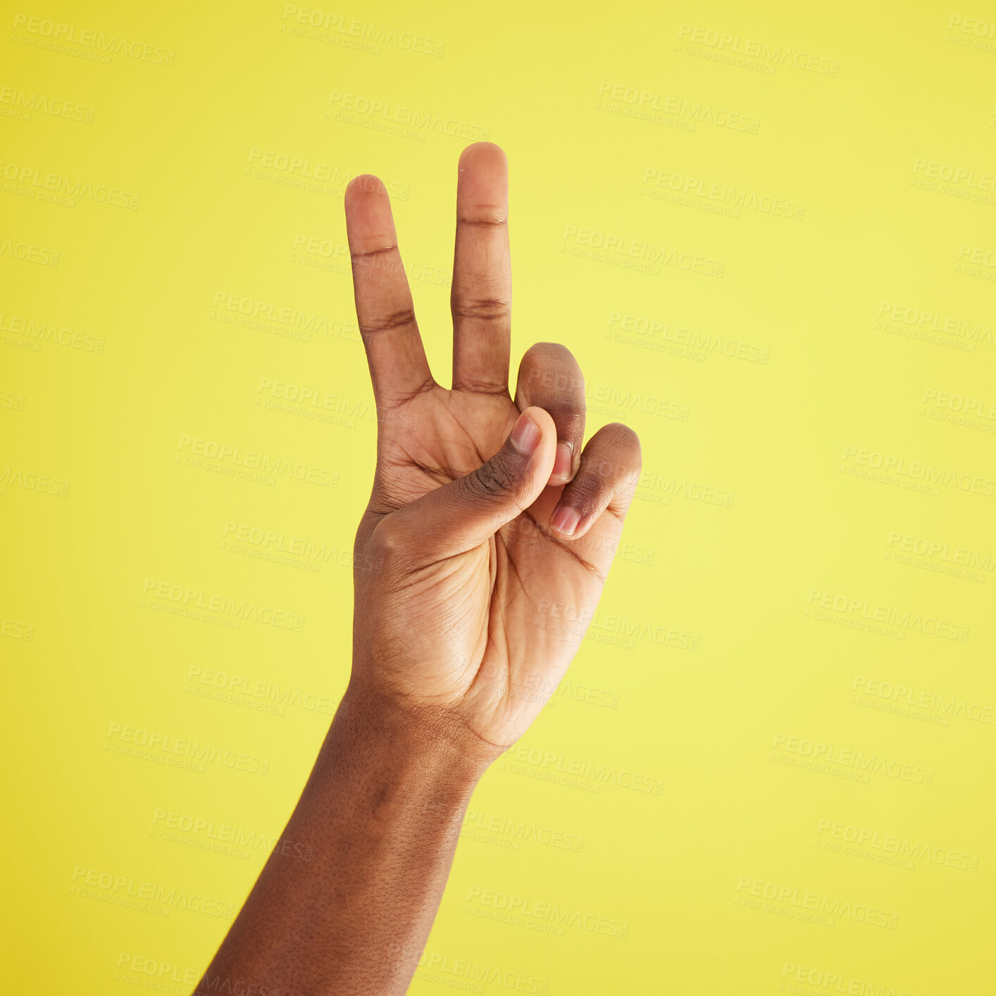 Buy stock photo Closeup, person and hand with peace, sign and support with agreement, respect and review on yellow studio background. African model, mockup and fingers for feedback, vote and emoji with icon and like