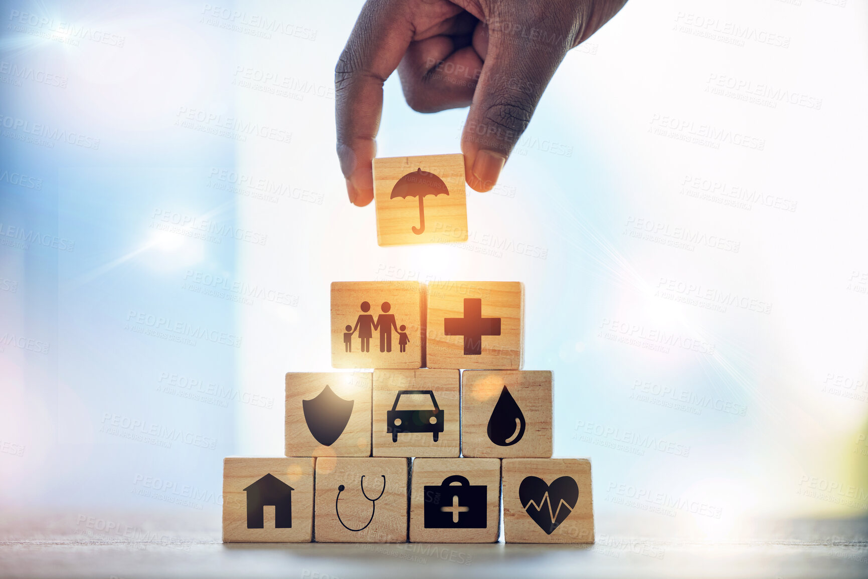 Buy stock photo Man, hand and building blocks with medical icon for investment, security and insurance cover. Finger, choice and male with puzzle for healthcare, family or asset management, safety or future planning