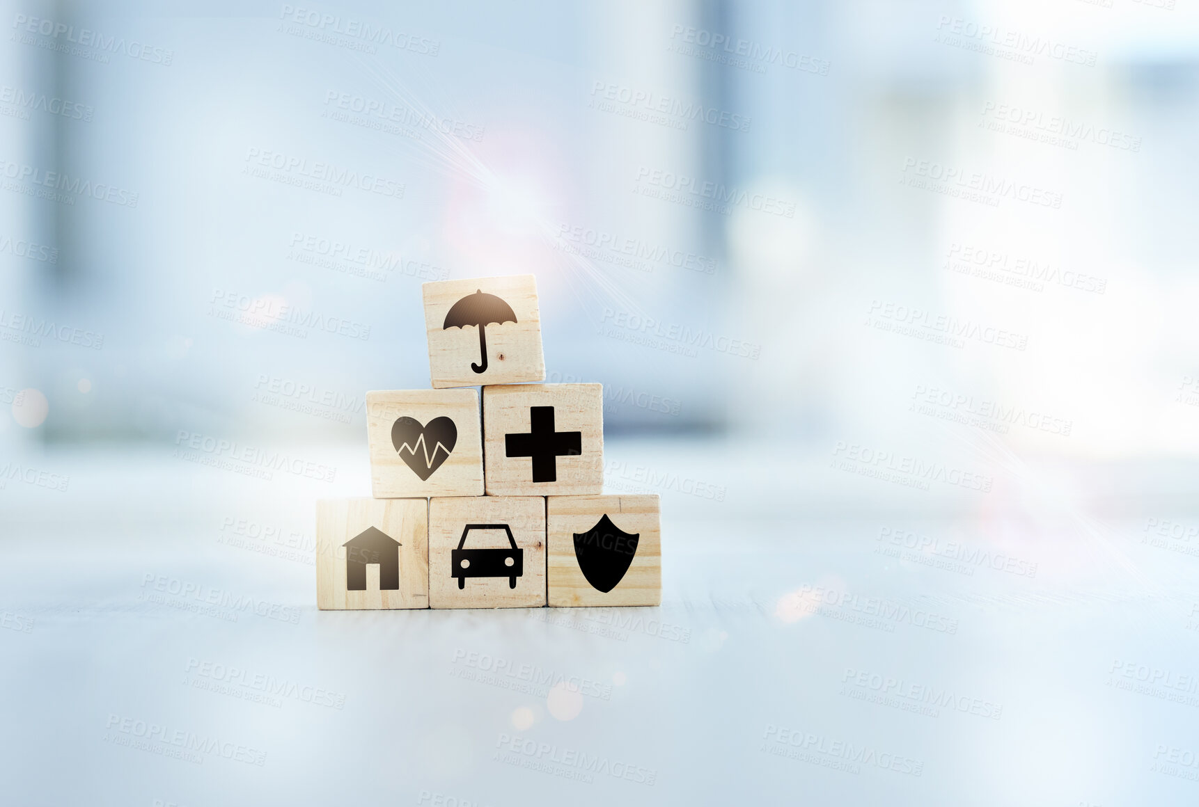 Buy stock photo Healthcare, insurance and medical with building blocks on desk in hospital for future planning or wellness. Medicine, pyramid and stack with symbol icons in clinic for life cover, finance or security