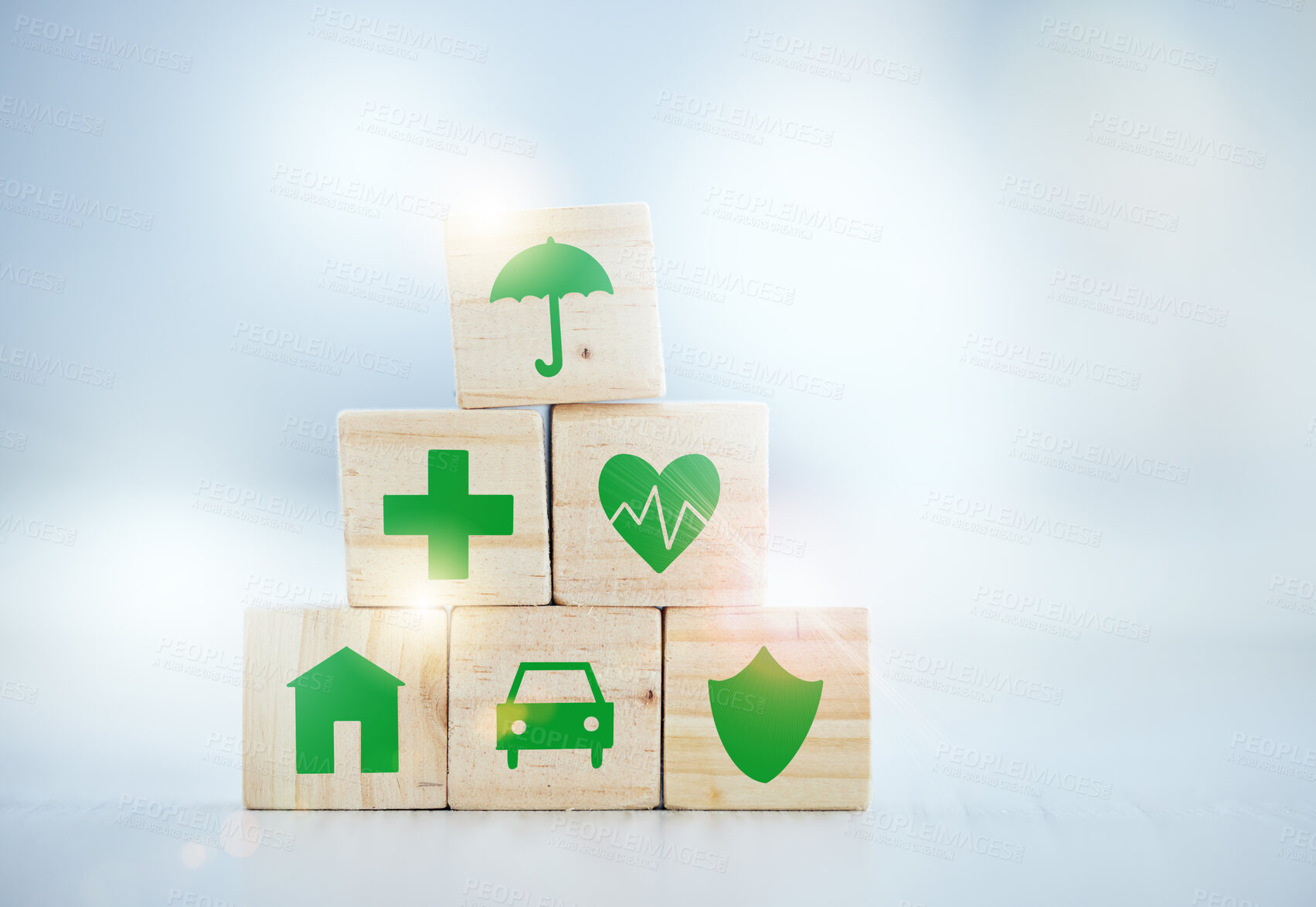 Buy stock photo Shot of wooden blocks with insurance related symbols on them