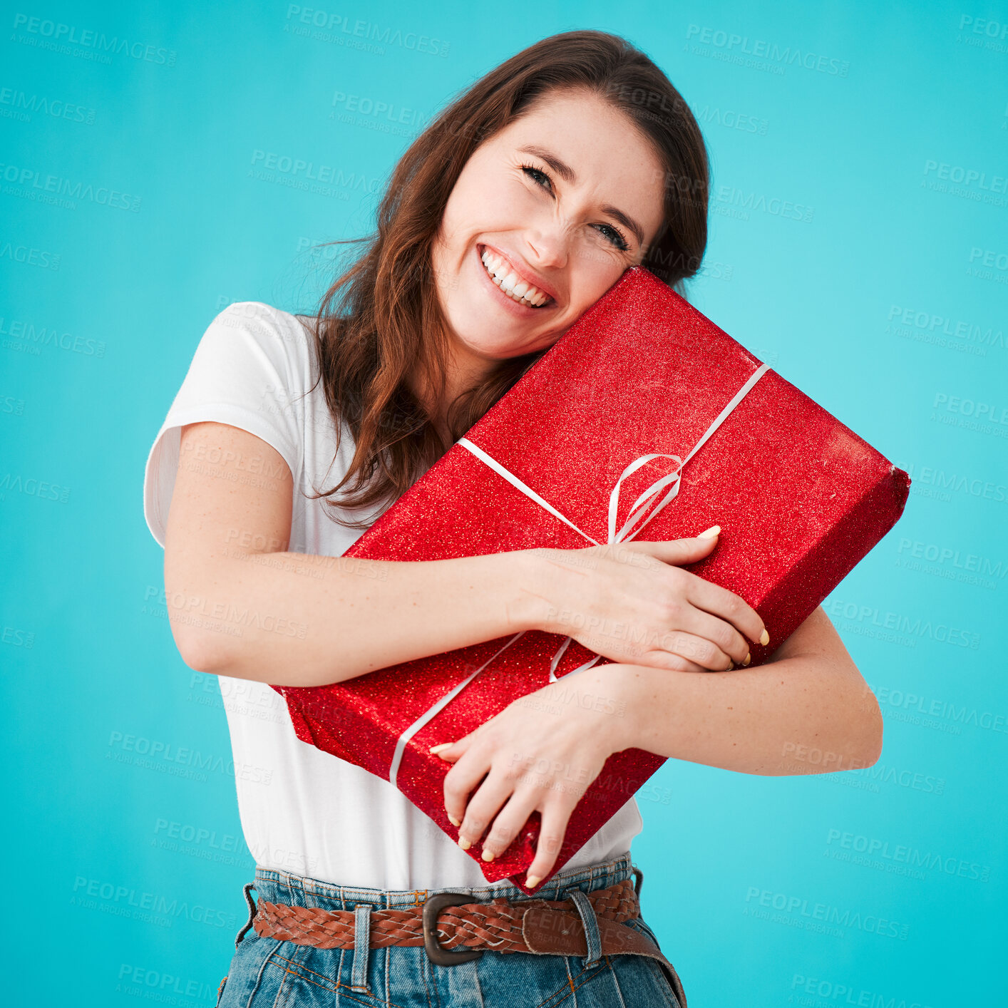 Buy stock photo Woman, studio and excited with gift in box or package with smile, eyes closed and laugh on blue background. Female person, portrait and happy with present as surprise,  giveaway product and prize