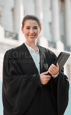 Buy stock photo Shot of a young female lawyer preparing for court in the city