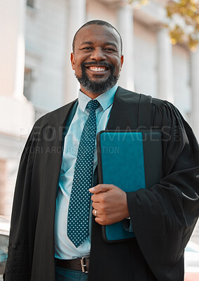 Buy stock photo Shot of a mature male lawyer preparing for court in the city