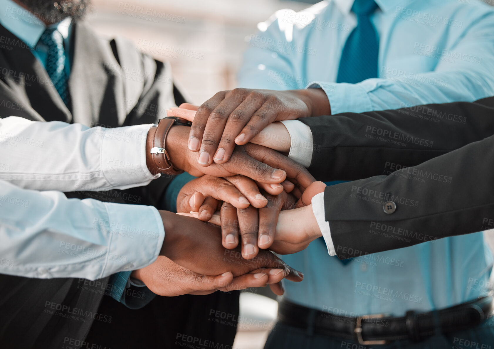 Buy stock photo Shot of a group of unrecognizable businesspeople stacking their hands in the city