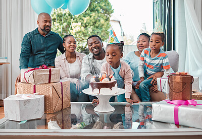Buy stock photo Shot of a little girl celebrating her birthday with her family at home