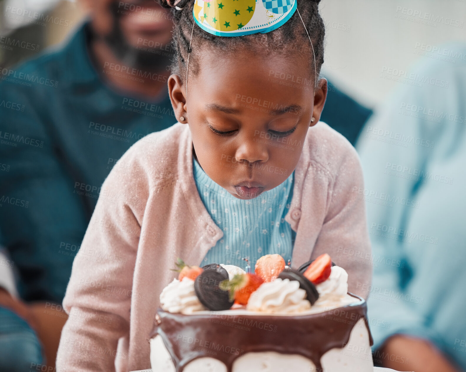 Buy stock photo Birthday cake, home and black child blowing candles for wishes, good luck or tradition at party. Happy, sparkle and African girl kid with sweet dessert for celebration at special event or surprise.