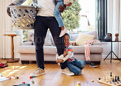 Buy stock photo Tantrum, crying and boy on leg of father shouting with anger, frustrated and upset emotions at home. Family, discipline and child holding parent scream with mess, laundry and toys in living room