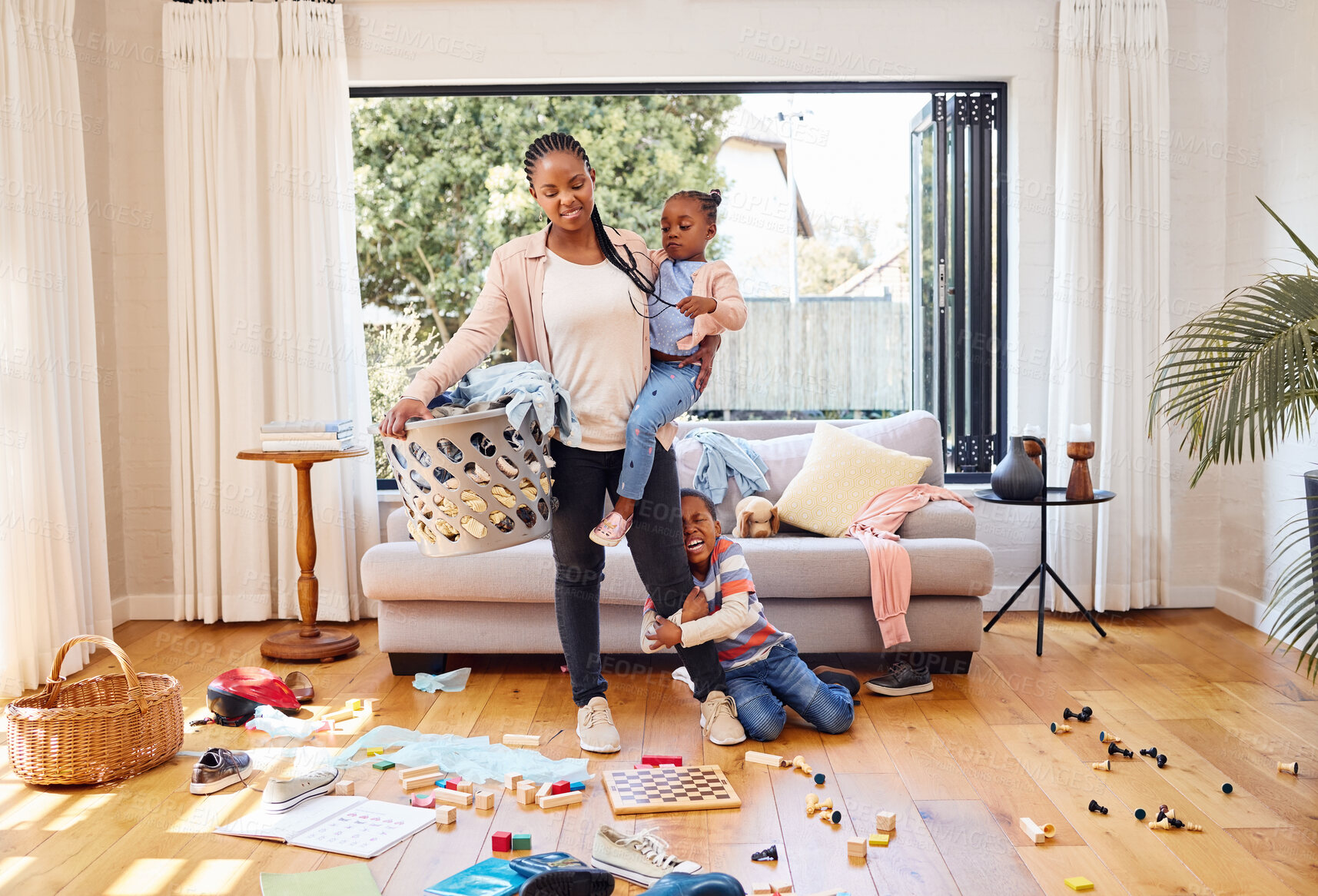 Buy stock photo Toys, children and mother with stress, laundry and home with tantrum, messy living room and anxiety. Family, mama and kids with housekeeping, burnout and mental health issue with untidy living room