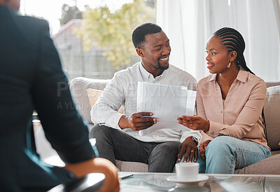 Buy stock photo Contract, married couple with financial advisor and documents in a living room of a home. Investment or investment, paperwork and planning with people in a meeting sitting on furniture together 