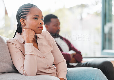 Buy stock photo People, black couple and sad for argument on sofa at home for disagreement, problems and unhappy. Toxic relationship, love and conflict or upset in living room on couch and disappointed with fight