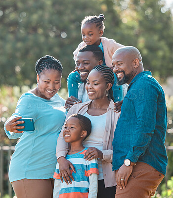 Buy stock photo Shot of a multi-generational family taking a selfie together