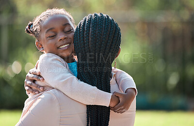 Buy stock photo Shot of an adorable little girl spending the day outdoors with her mother