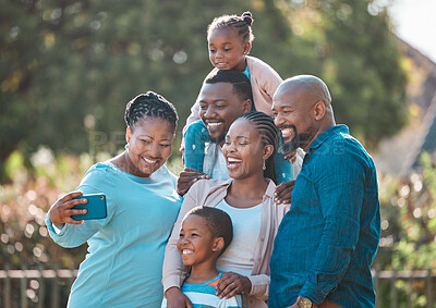 Buy stock photo Shot of a multi-generational family taking a selfie together