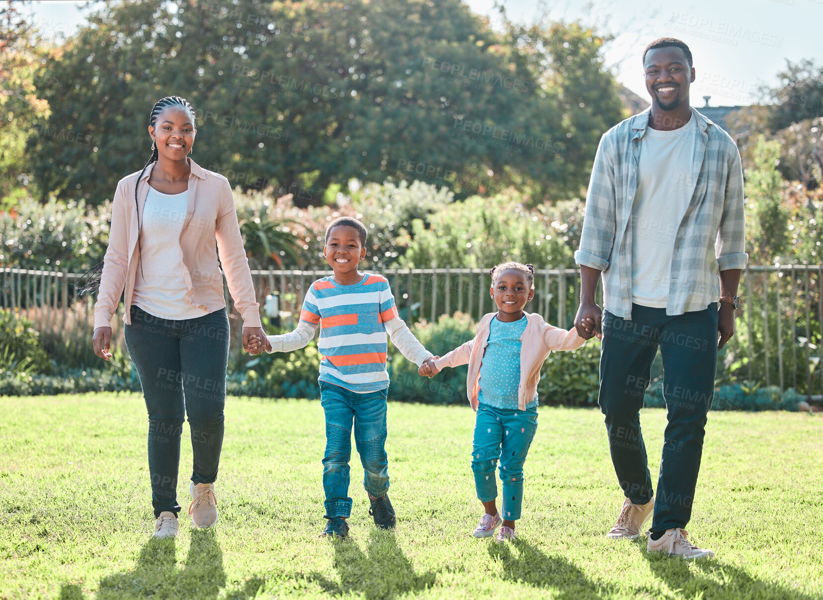 Buy stock photo Happy black family, portrait and holding hands outdoor for safety, protection and love. African kids, mother and father in backyard for support, security and people bonding together for care on grass