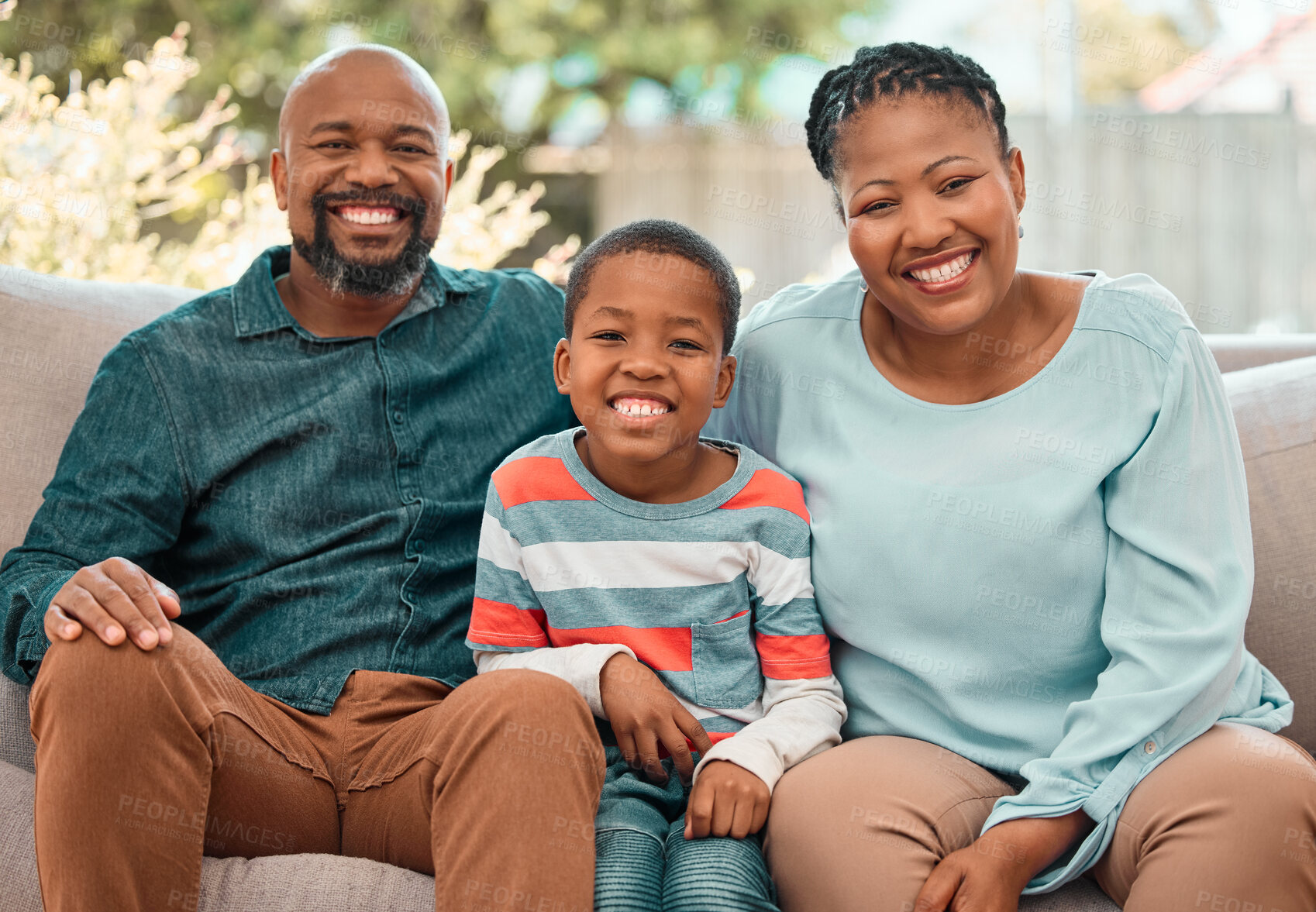 Buy stock photo Shot of a little boy spending time with his grandparents at home