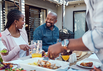 Buy stock photo Outdoor, black family and food with event, happiness and bonding together with conversation. Group, parents or healthy meal in garden, celebration or cheerful with nutrition, home or social gathering