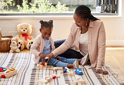 Buy stock photo Black family, education and building blocks with girl learning from mother on floor of living room. Kid, growth and toys for child development with woman teaching daughter in home lounge for play