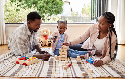 Buy stock photo African parents, bonding and building blocks with girl learning from family on floor of living room. Kid, growth and toys for child development with father and mother teaching daughter in home lounge