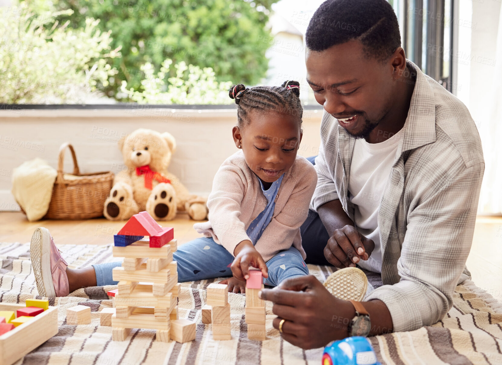 Buy stock photo Black man, play and building blocks with girl learning from father on floor of living room. Kid, growth and toys for child development with dad teaching daughter in home lounge for education