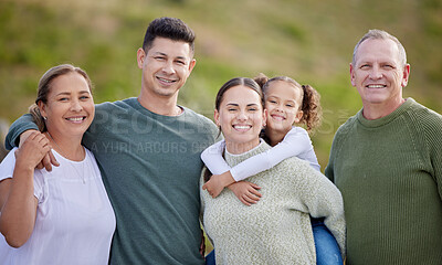 Buy stock photo Shot of a multi-generational family spending time together outdoors