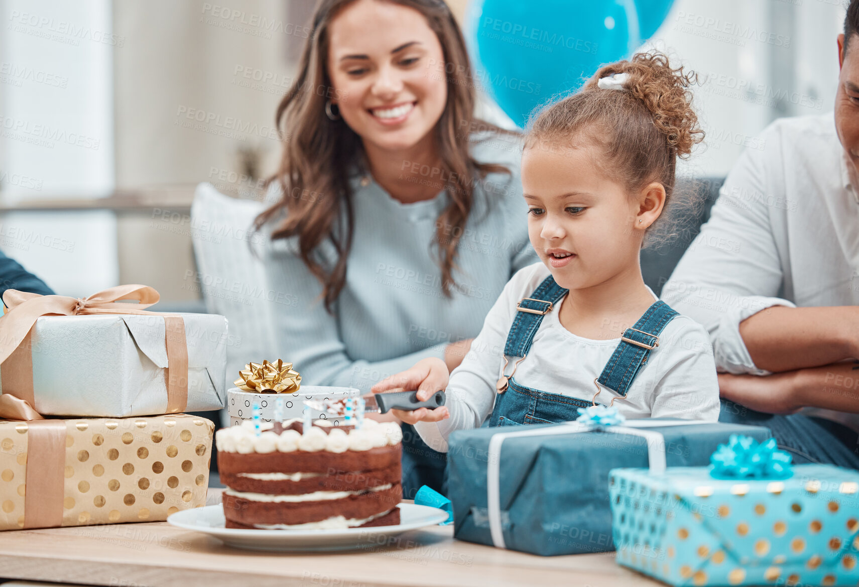 Buy stock photo Shot of a happy family celebrating a birthday at home