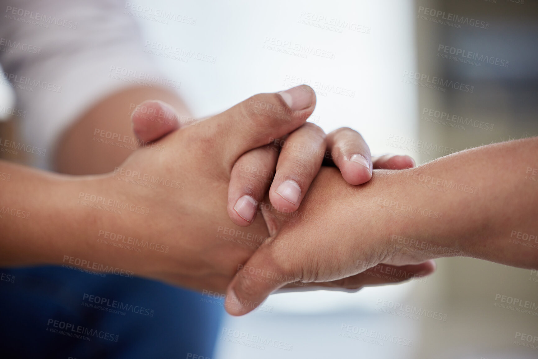 Buy stock photo Holding hands, people and support in clinic for counseling, communication and mental health with care. Empathy, client and employee help in workplace for therapy, psychology and trauma rehabilitation