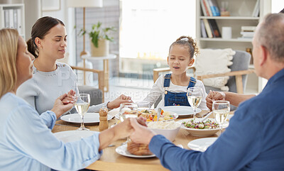 Buy stock photo Home, big family and prayer with, food, holding hands and faith with healthy meal, nutrition and love. Praying, apartment or parents with girl, lunch or party with event, social gathering or religion