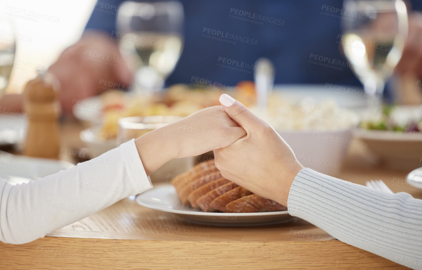 Buy stock photo Closeup, holding hands and people with prayer for food, dinner meal and gratitude with worship for christian. Family, grace and spiritual connection for religion with thanks giving, grateful and home